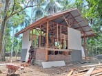 Satgas TMMD ke-129 Kodim 0102/Pidie Kebut Rehab Rumah Ibu Rabunmah Amin, Capai 45 Persen